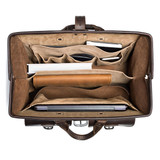 High quality this dark brown leather briefcase is wide open and full of laptops and other things for lawyers.