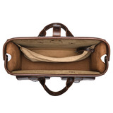 High quality the inside of the dark brown flight bag leather briefcase showing the gladstone closure in use. Made by Saddleback