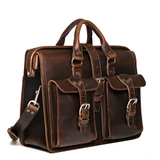 High quality dark brown flight bag leather briefcase at an angle to show the sizing better. Made by Saddleback