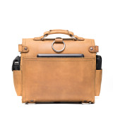 High quality back view  of a tan brown rounded leather satchel.
