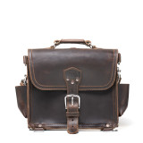 High quality front view of a dark brown rounded leather satchel.