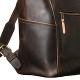 High quality side pocket view of the leather all in one backpack in dark coffee