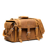 High quality tan side pocket duffle from the front. Made from full grain leather (toughest there is) and reinforced with rivets on any stress points. Made by Saddleback Leather