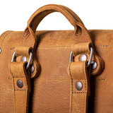 High quality closeup of the handle on the tan tumbled leather 12" drawstring backpack. Only the best stainless steel is used for these over-engineered bags. Made by Saddleback