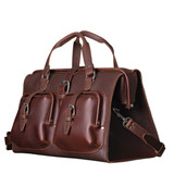 High quality angled view of Saddleback Leather's Deep Pocket Leather Duffle Bag in Red Brown / red brown