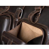 High quality close-up front deep pocket view of Saddleback Leather's Deep Pocket Leather Duffle Bag in Dark Brown / dark brown