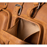 High quality close-up front deep pocket view of Saddleback Leather's Deep Pocket Leather Duffle Bag in Tan Brown / tan