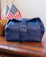 This is the rolled toiletry bag in a lifestyle image