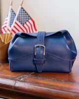 High quality rolled leather toiletry bag in a lifestyle image