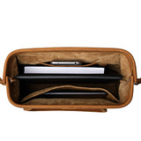 High quality top down view of leather purse with items in it.