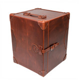 High quality red brown leather trunk stood up as a side table, closed. Made by Saddleback