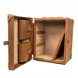 Opened tobacco colored trunk stood up as a side table with the shelves taken out. Made by Saddleback