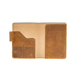 High quality inside of the tan colored leather journal cover that has 1 medium pocket, 2 small pockets, a pen holder, and a place to hold your journal. Made by Saddleback