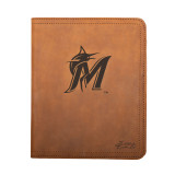 High quality tan colored leather portfolio with the Miami Marlins logo on the front. Made by Saddleback