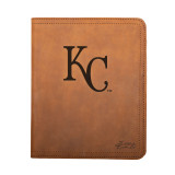 High quality tan colored leather portfolio with the Kansas City Royals logo on the front. Made by Saddleback