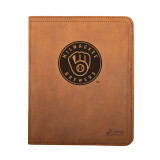 High quality tan colored leather portfolio with the Milwaukee Brewers logo on the front. Made by Saddleback