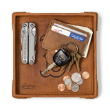 High quality tan colored leather valet tray with the Boston Red Sox logo, and things in the tray such as a wallet, keys, change, and a pocket knife. Valet tray made by Saddleback