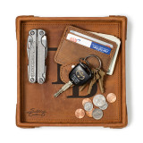 High quality tan colored leather valet tray that is holding a wallet, keys, change, and pocket knife. Made by Saddleback