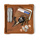 High quality tan leather valet tray with a wallet, keys, change, and a pocket knife in it. Made by Saddleback