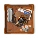 High quality tan colored leather valet tray with a wallet, keys, change, and a pocket knife on it. Made by Saddleback