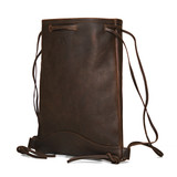 This is the dark coffee brown opened flat backpack at an angle. Made by Saddleback