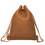 This shows the closed tobacco flat drawstring backpack. Made by Saddleback Leather