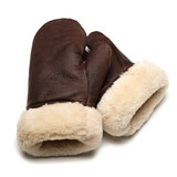 High quality dark brown sheepskin mittens laying on top of one another. Made by Saddleback