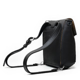 High quality the side view of the black colored 10" tumbled drawstring leather backpack. Made by Saddleback