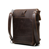 High quality the back of the dark brown 10" tumbled drawstring leather backpack with a loop to adjust the straps. Made by Saddleback