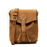 High quality the front of the 10" tumbled drawstring leather backpack in the color tan. Made by Saddleback