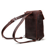 High quality back of the tumbled red brown convertible crossbody in leather backpack mode. Made by Saddleback