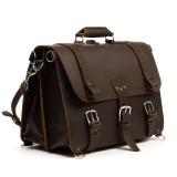 High quality front view angled of a large dark brown full grain leather briefcase.