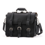 This is the front view of a black full grain leather briefcase with two side straps and a middle strap.