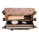 High quality top view of the full grain leather briefcase with the flap open to see what it can hold. The lining is tan.