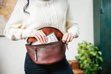High quality model shot of the red brown fanny leather bag