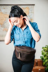 High quality model shot of the dark coffee fanny leather bag