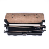 High quality this dark brown leather briefcase is wide open with two gussets and a light tan interior.