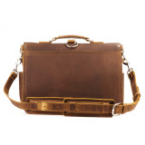 High quality back view of a brown leather briefcase with a shoulder strap.