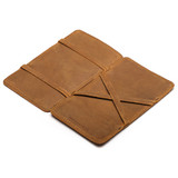 High quality tan leather large magic wallet from the inside. The money moves when you flip around the wallet flap. Made by Saddleback
