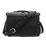 High quality back of a black slim leather briefcase with the strap behind it.