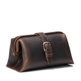High quality dark brown leather toiletry bag on the front side.