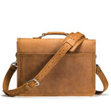 High quality back of a tan brown leather briefcase that is slim and easy to carry