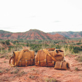Here is a few of our tobacco pieces out in the dessert. This includes the waterbag, briefcase, and little big mouth toiletry bag. Made by Saddleback