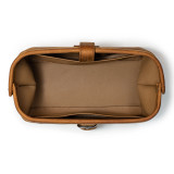 High quality dark brown leather toiletry bag from the top angle.