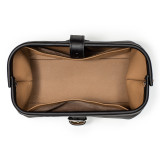 High quality black leather toiletry bag from the top empty.