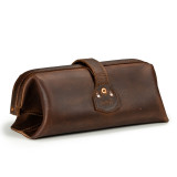 High quality red brown leather toiletry bag from the back angle.