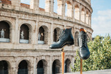 High quality saddleback Leather boots in Pitch Black in front of the Colosseum.