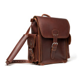 High quality squared red brown leather backpack with an old phone behind the side pocket.