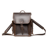 High quality dark brown leather backpack front view with a front pocket and two side pockets.