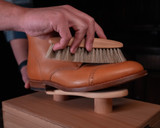 High quality lifestyle image of the shoe shine kit being used